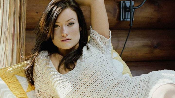 Olivia Wilde Laying Pose On Bed In White Dress